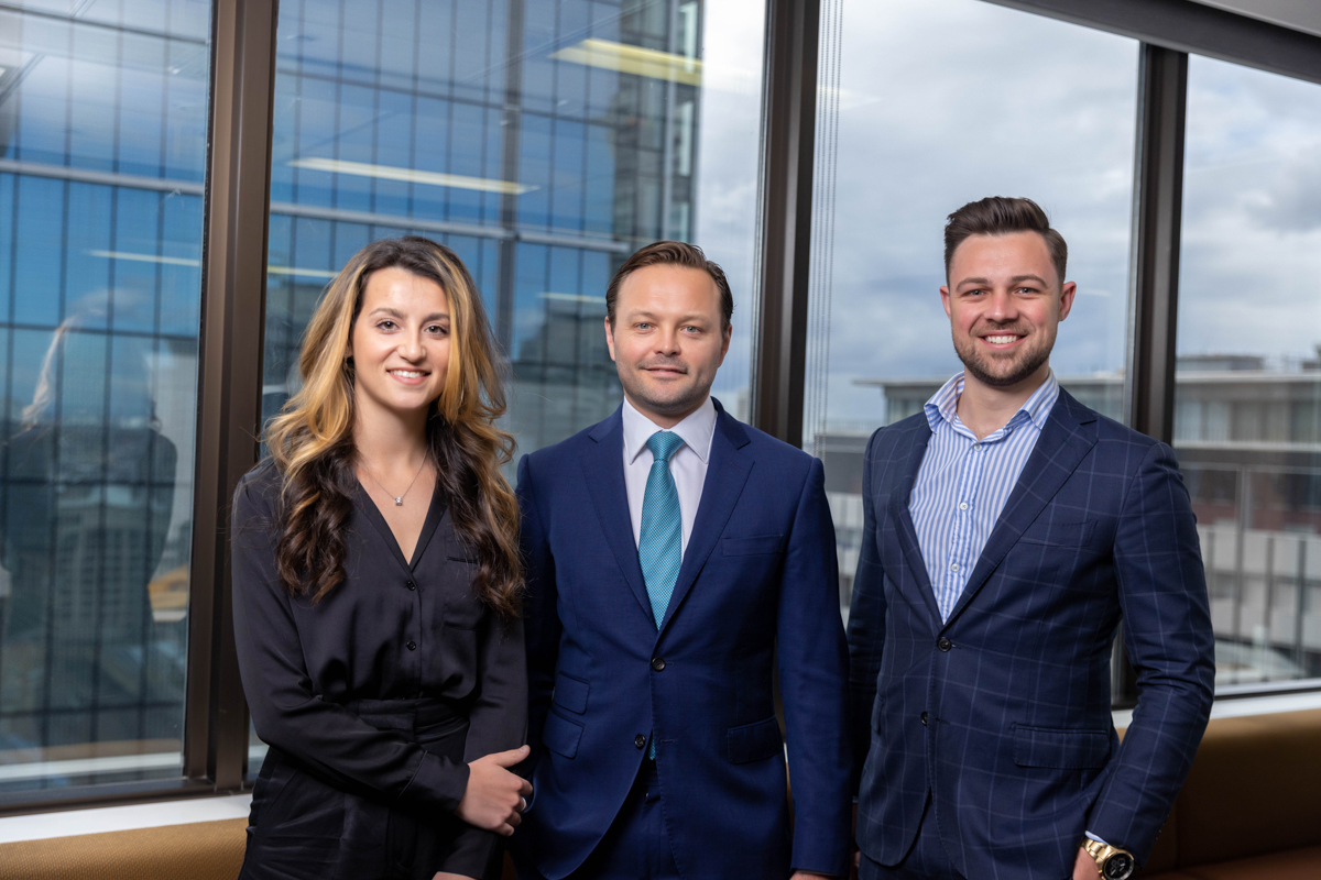 Aura Private Credit Australia group photo standing against Sydney city background