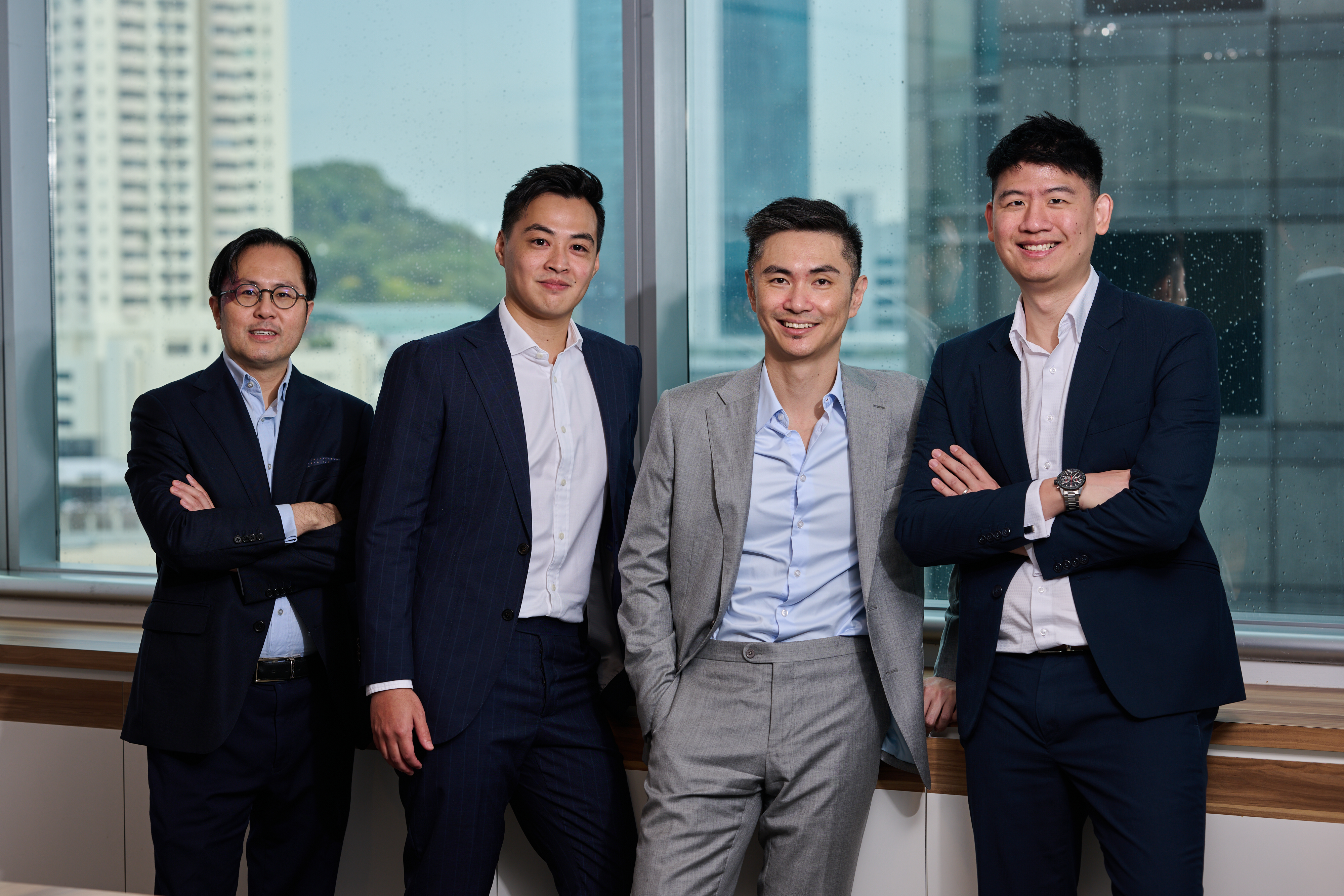 Aura Private Equity Singapore team standing together against a city scape